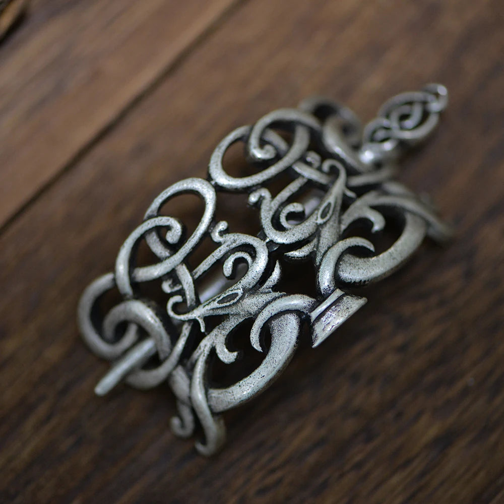 Jelling-inspired hair pin brooch with ribbon-like animals and Norse artistry.