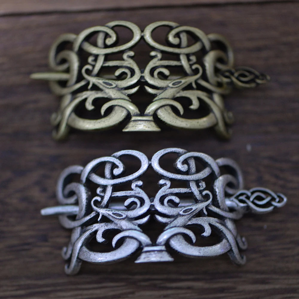 Hair pin brooch inspired by the Viking Jelling style with ribbon-like animal motifs.