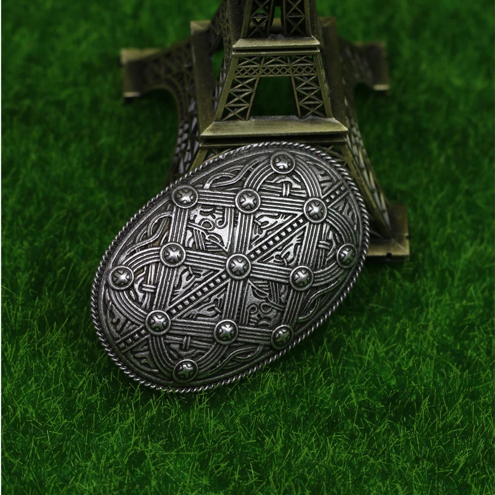 Intricate brooch with Celtic knots and Viking patterns.