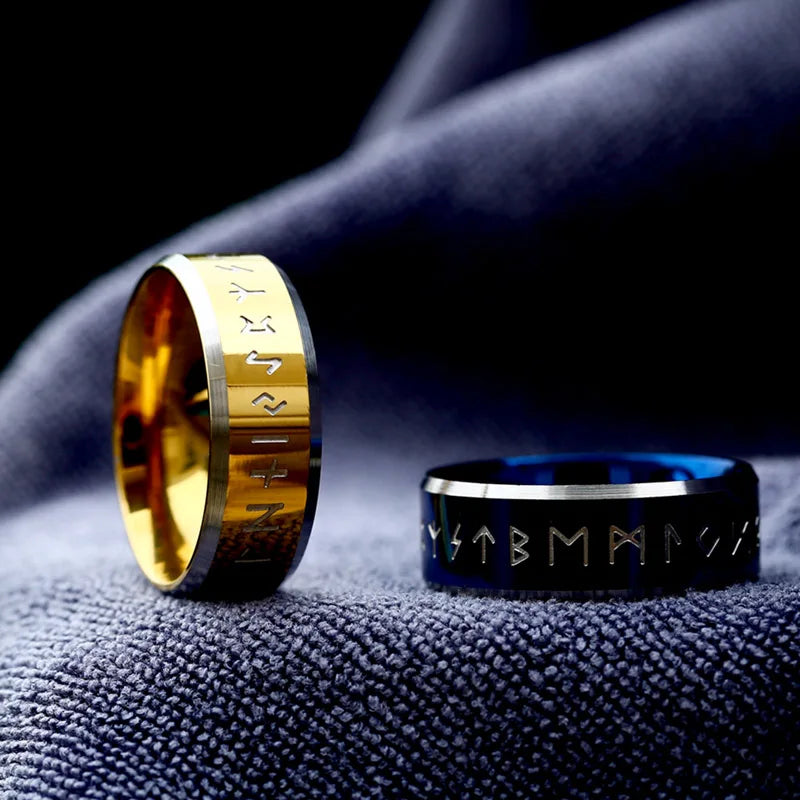 Polished gold ring with engraved runes on band