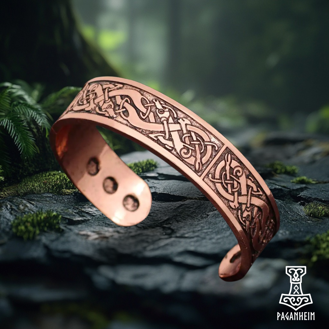 Copper-colored Urnes art style bracelet with intricate Norse engravings.