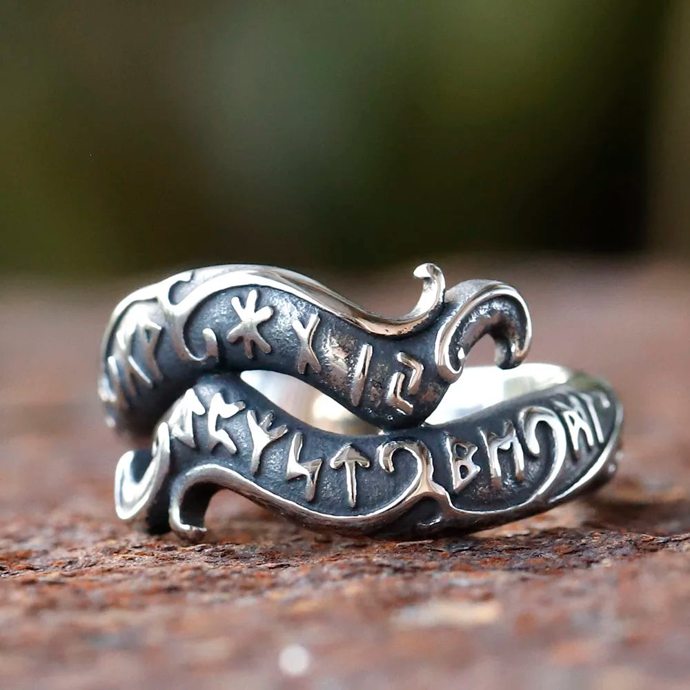 Norse-inspired ring featuring ancient Germanic runes carved in a curving style.