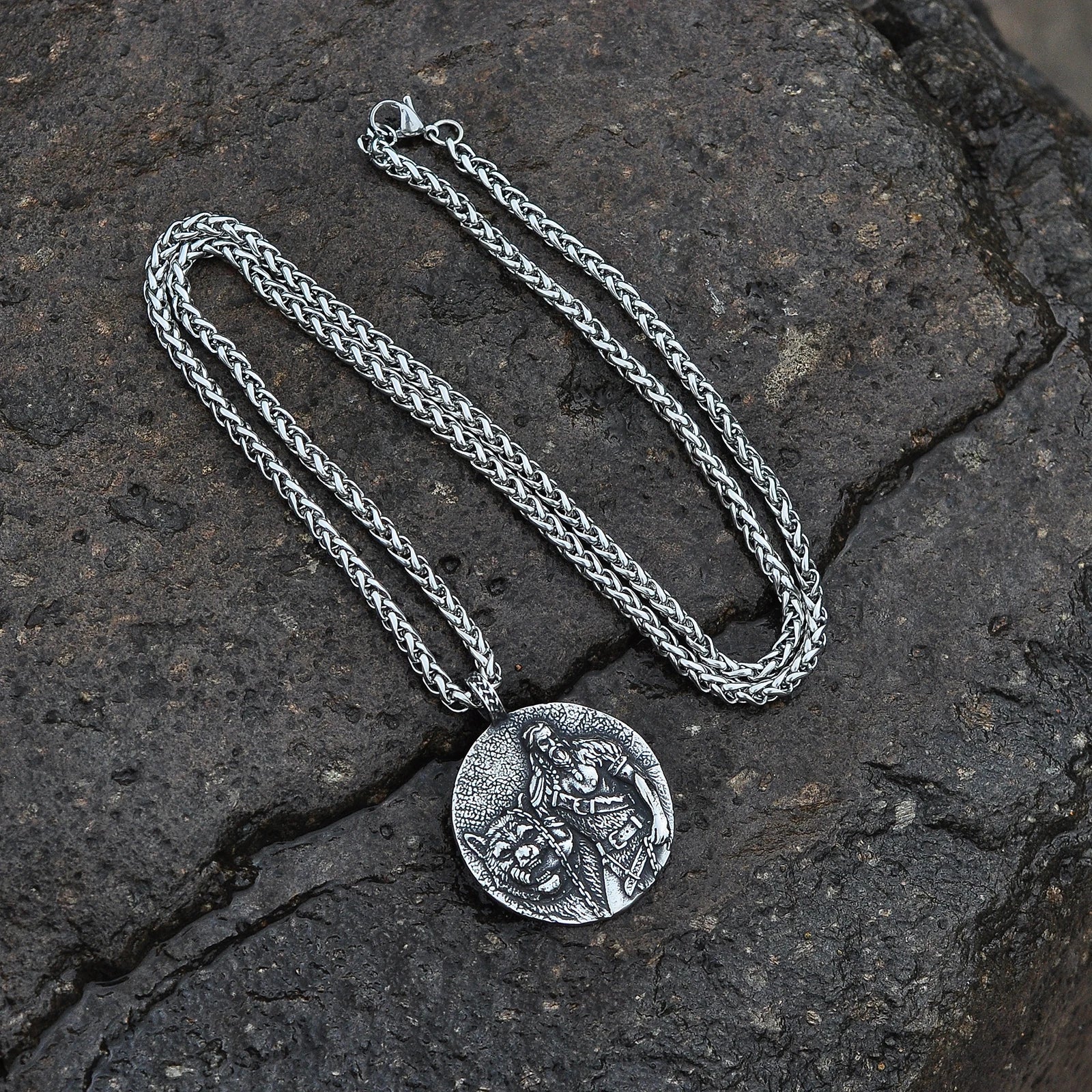 Engraved Tyr pendant showcasing Norse god and Fenrir