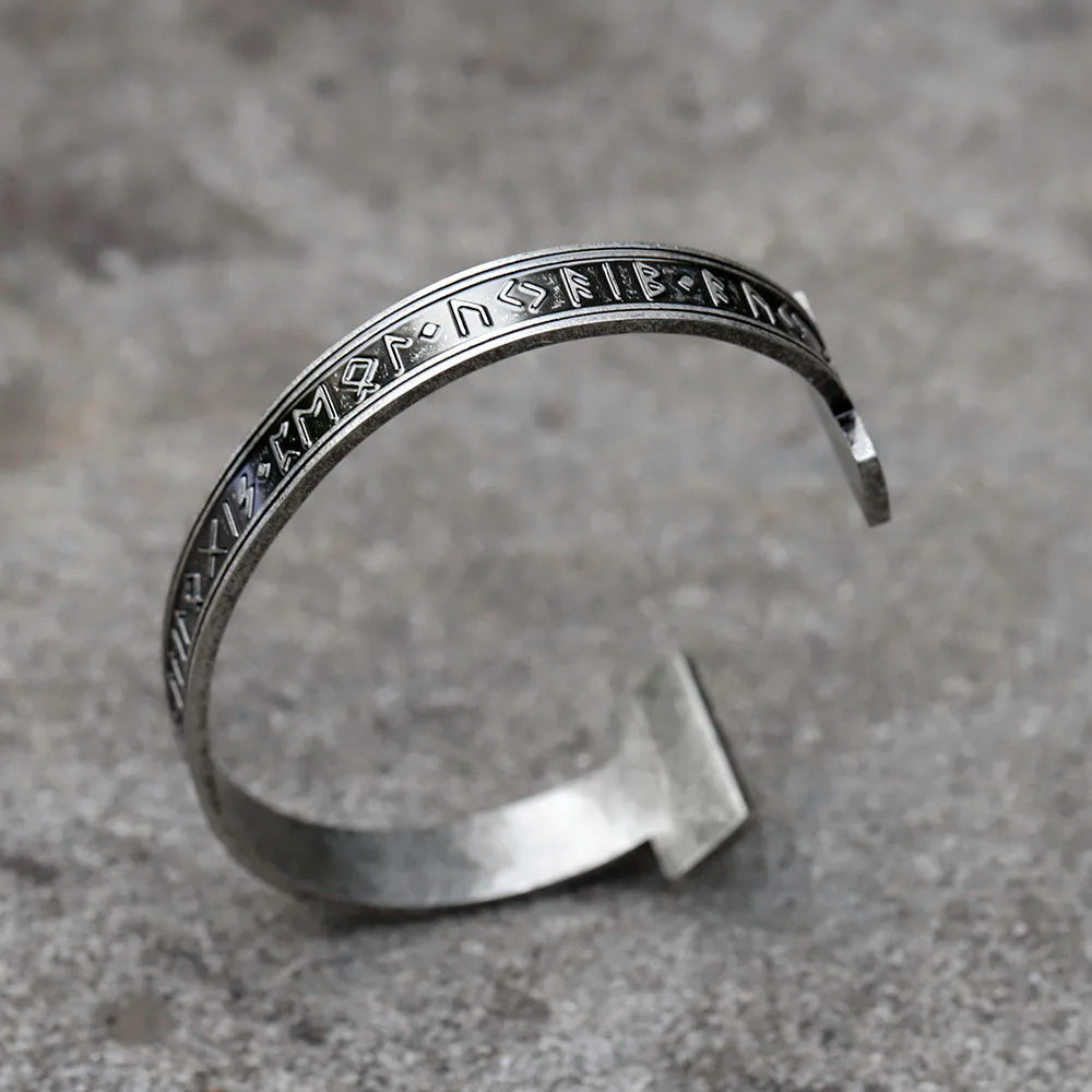 Norse-inspired cuff bracelet featuring Elder Futhark runes and a universal fit.