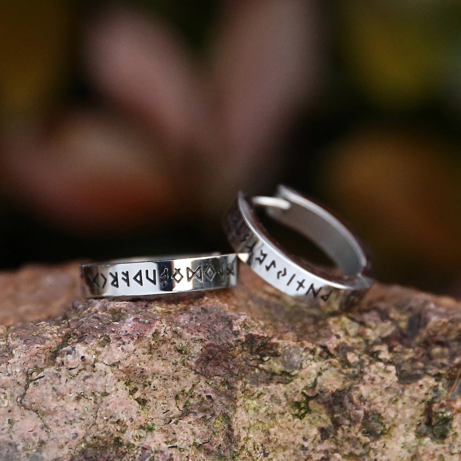 Silver Elder Futhark rune earrings inspired by ancient Norse runic inscriptions.