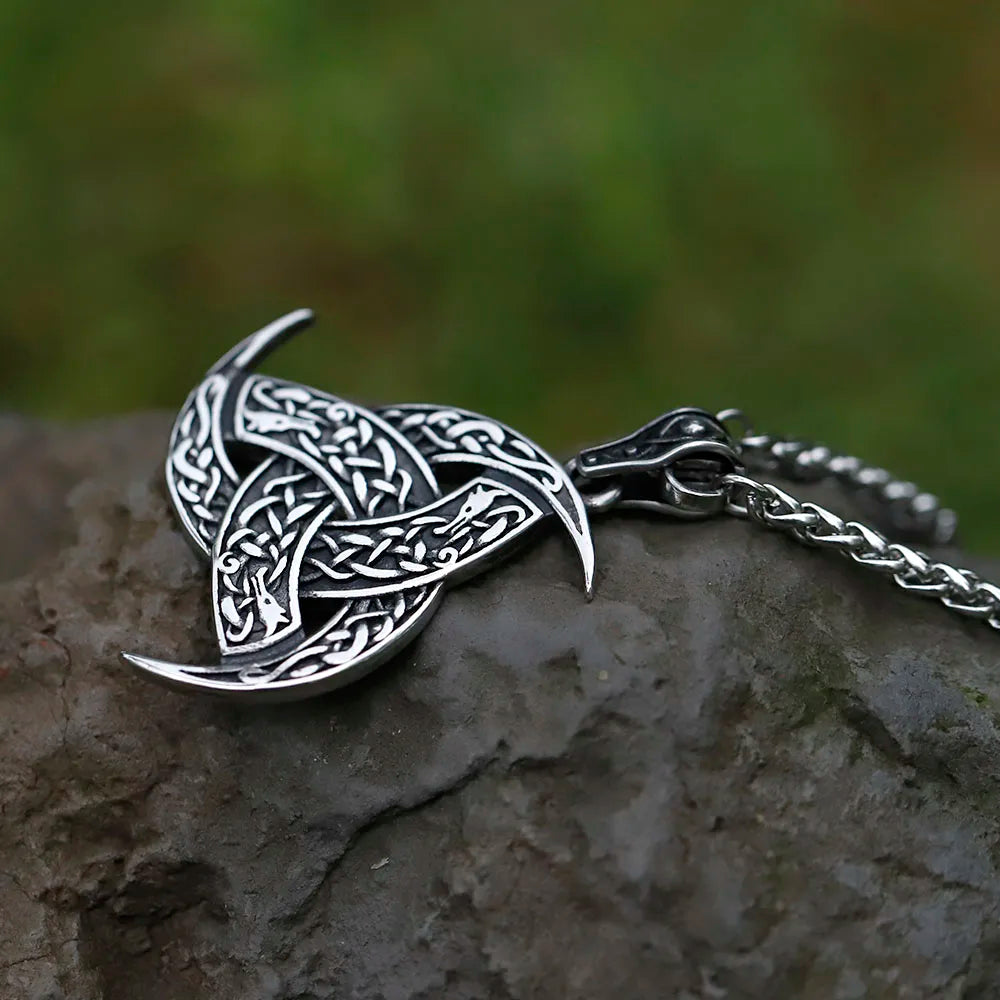 Close-up of Triple Horn of Odin necklace with detailed design.