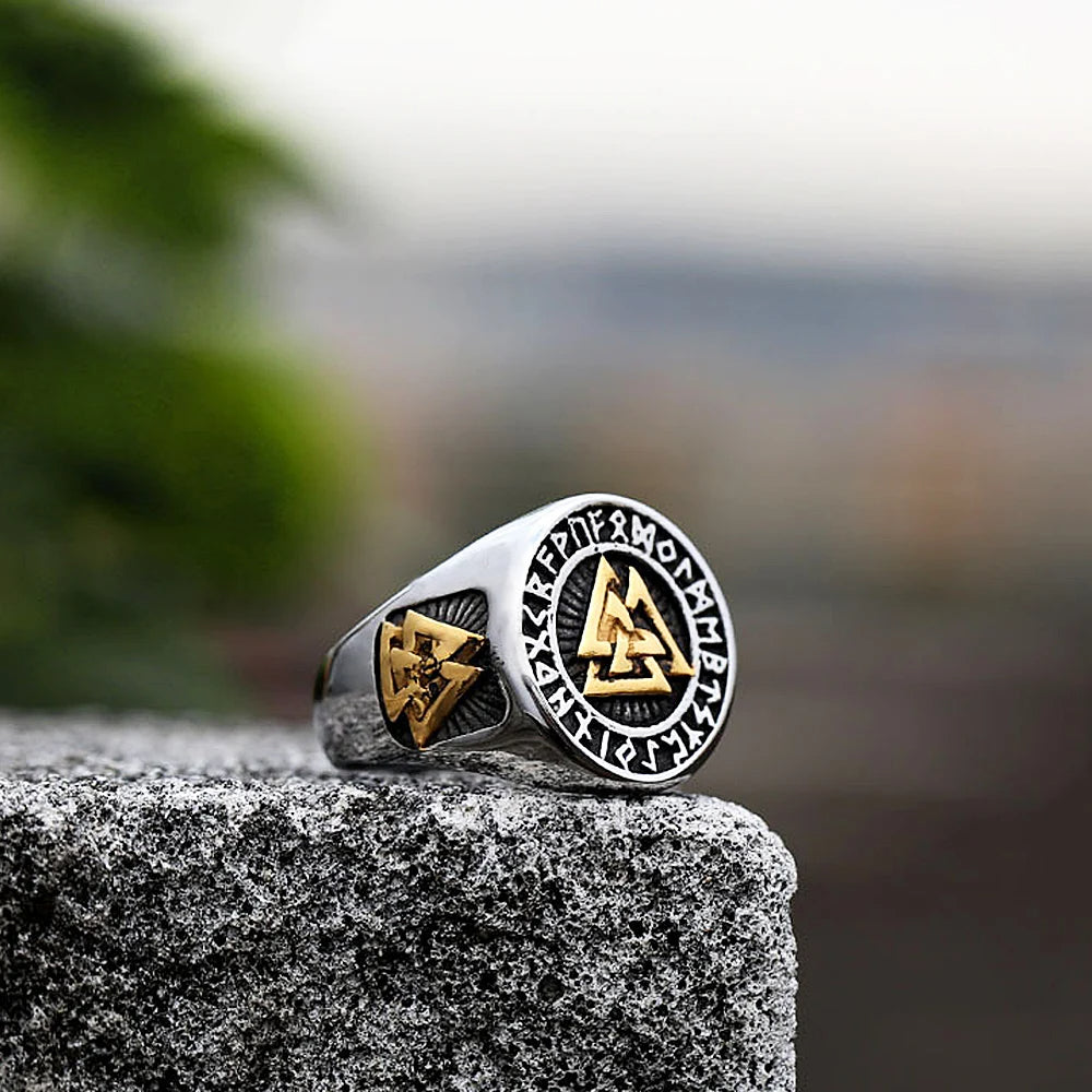 High-quality stainless steel ring with the Valknut symbol and detailed Norse designs, available in silver and mixed silver and gold options.