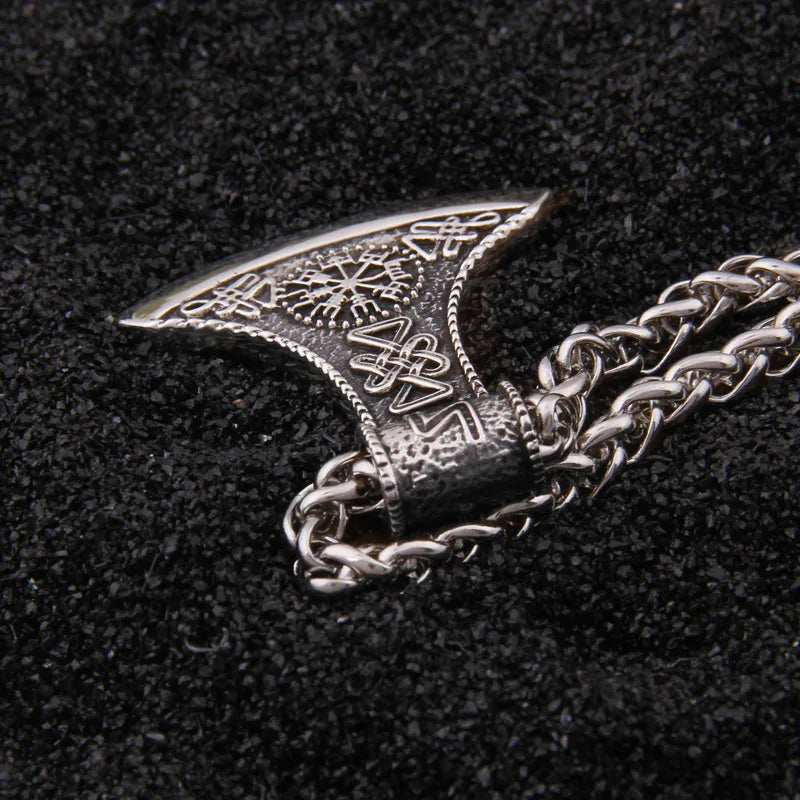 Norse axe pendant featuring intricate designs and Viking symbols.