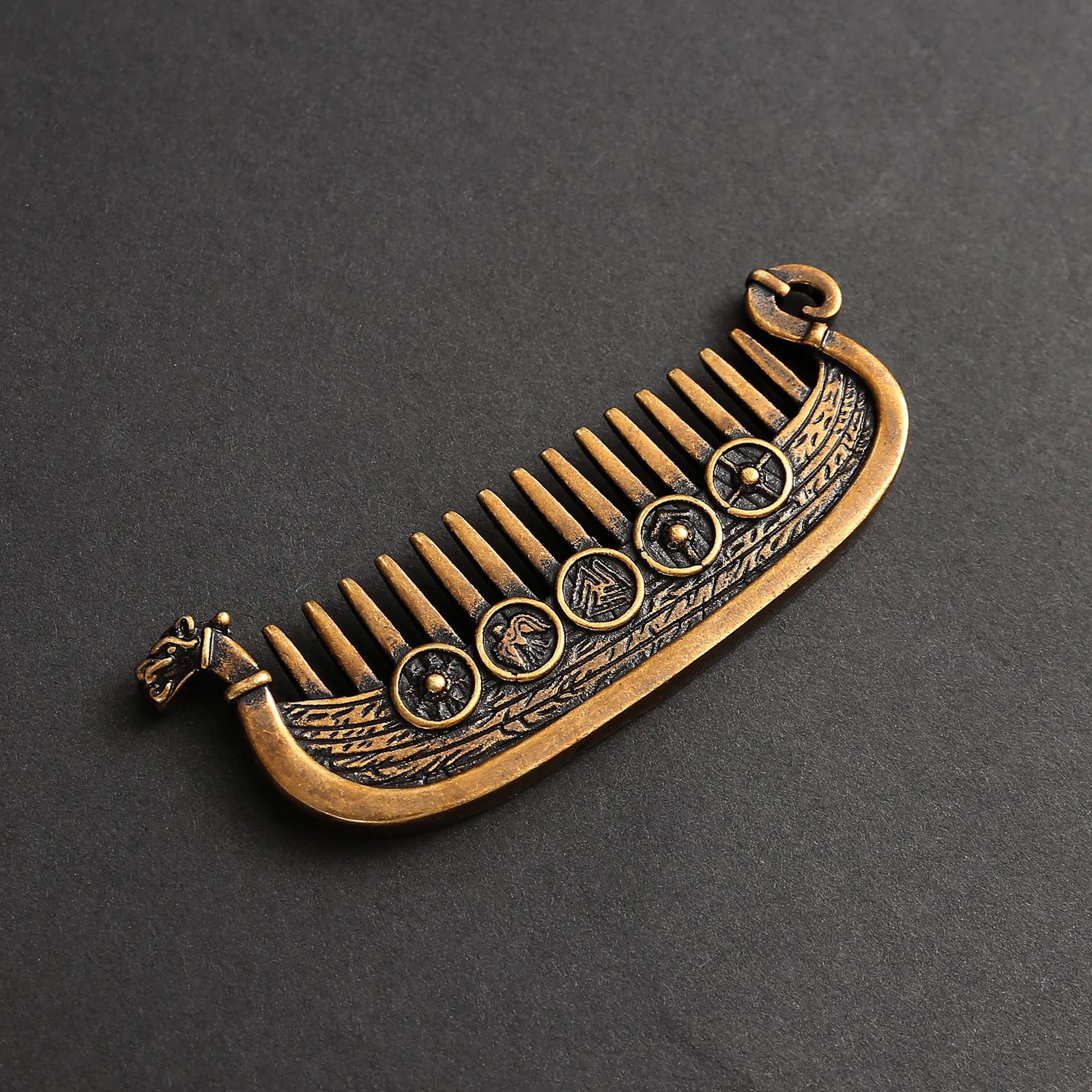 Detail of runic shields on the side of Viking longship hair comb