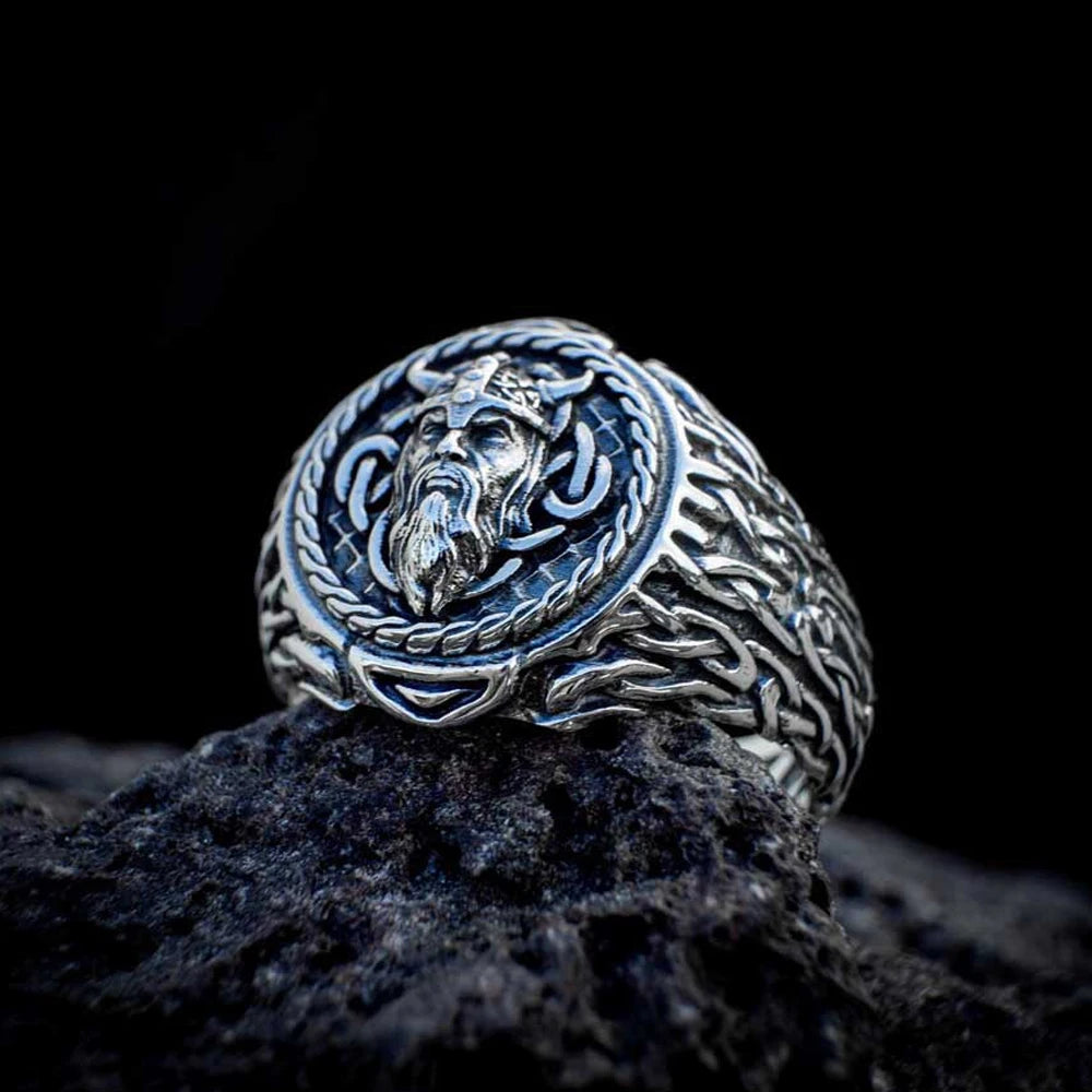 Close-up of a Viking warrior ring with detailed engravings of a warrior’s face and Norse patterns, crafted from high-quality stainless steel.