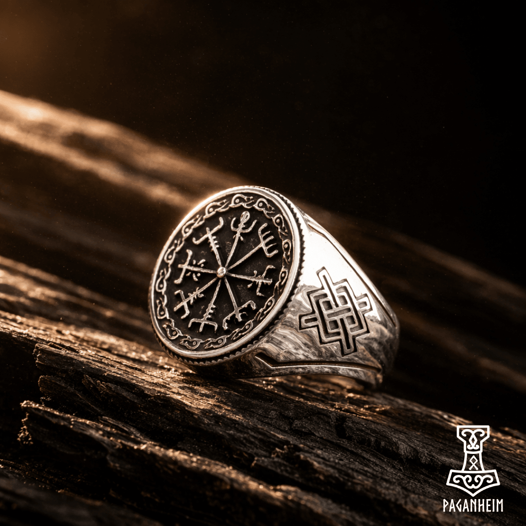 Closeup of Viking compass design engraved on silver‑tone ring