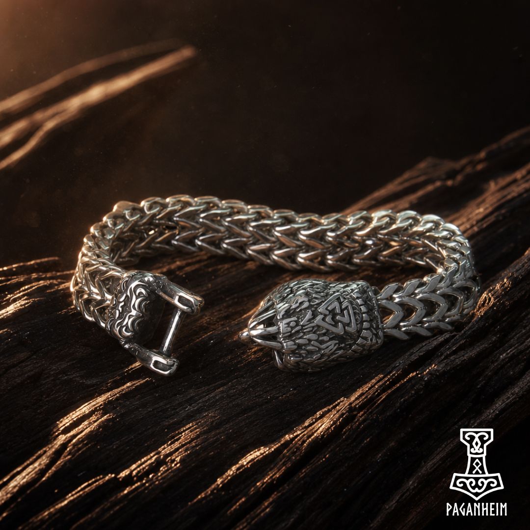 Silver bracelet featuring bear‑claw clasp engraved with Valknut symbol
