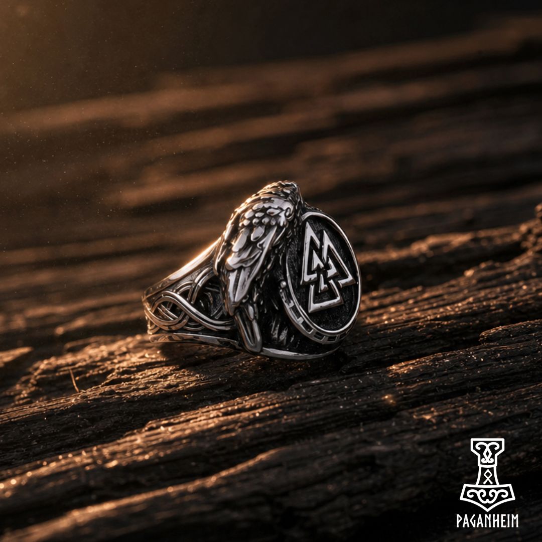 Silver ring featuring engraved Valknut symbol and raven wing design