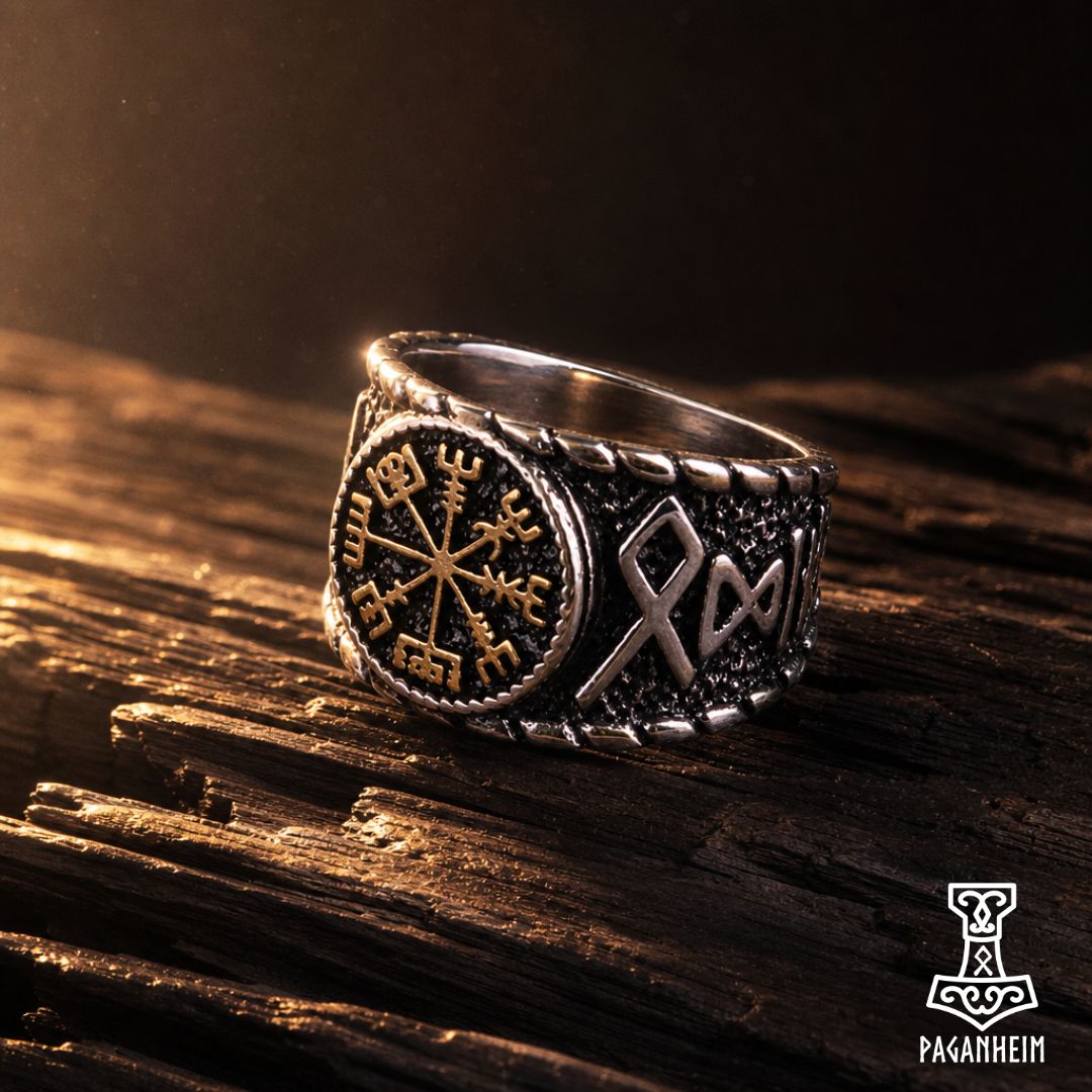 Norse Vegvísir ring resting on wooden surface under warm light.