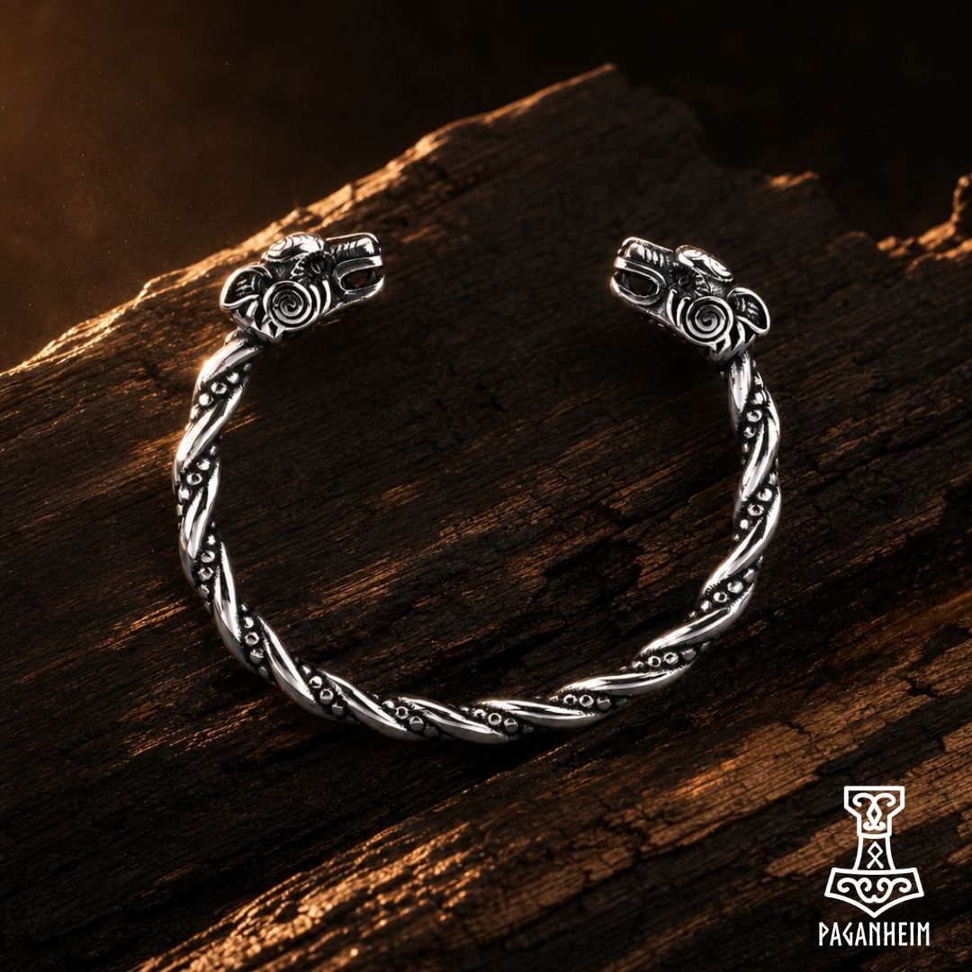 Stainless steel arm ring featuring detailed wolf heads on each end