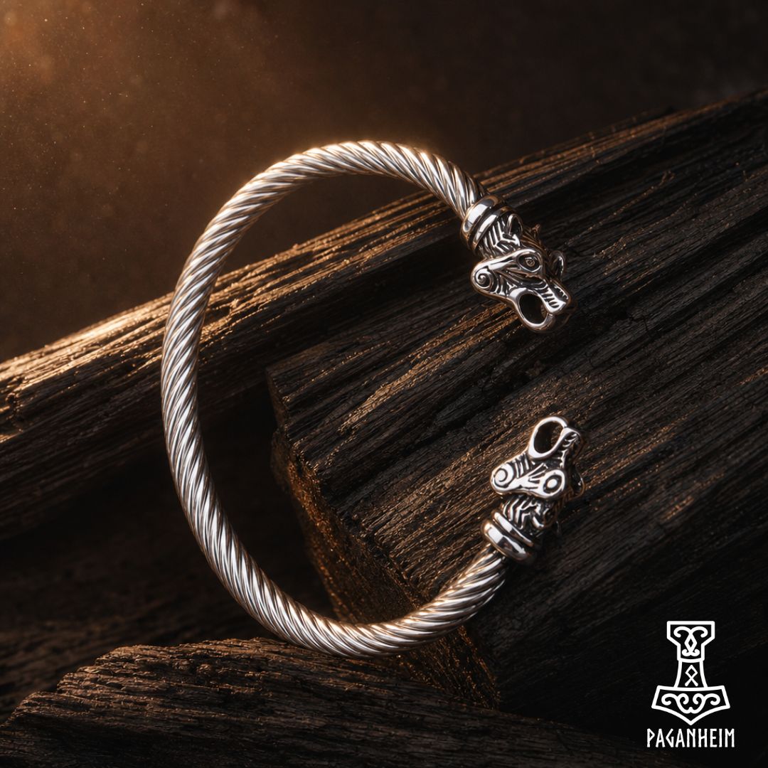 Silver arm ring featuring sculpted bear heads at each end