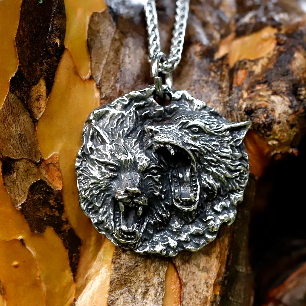 Detailed pendant showing Sköll and Hati with open jaws on a Norse mythology necklace.