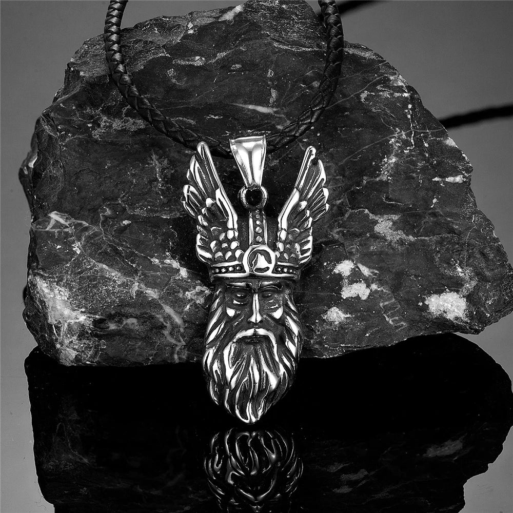 Odin face pendant carved with a ceremonial horned-helm motif.