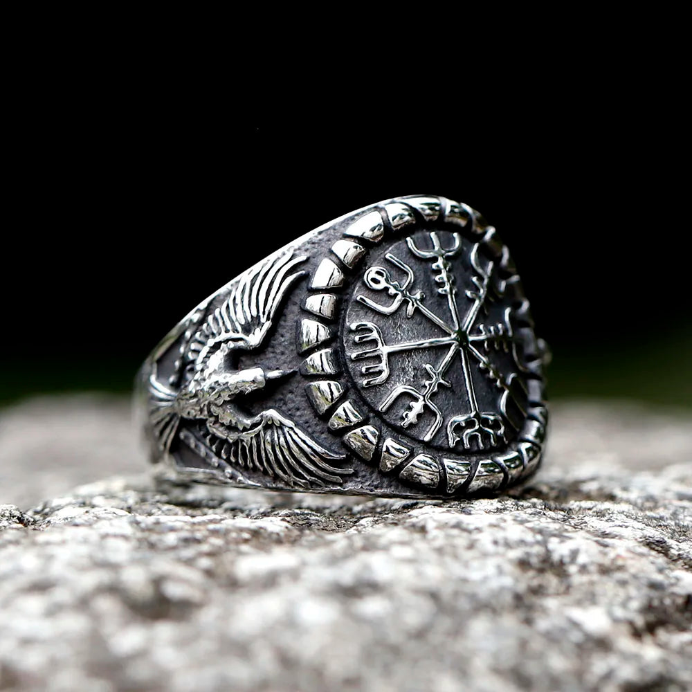 Norse compass symbol ring flanked by soaring eagles