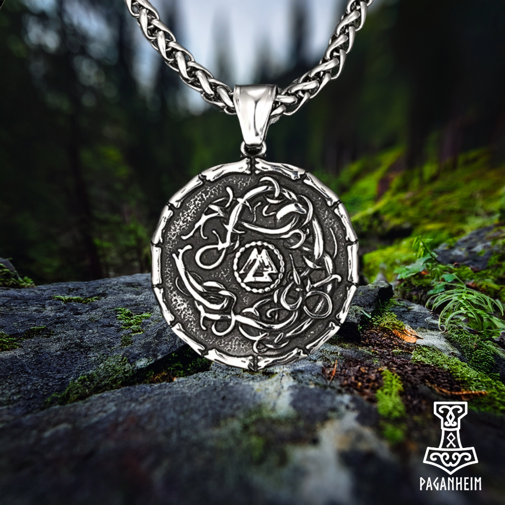 Norse shield amulet engraved in Urnes art style with wyrms