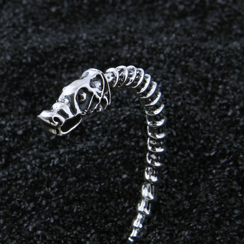 Intricately crafted Sterling Silver Viking arm ring with intertwined strands and dragon ends.