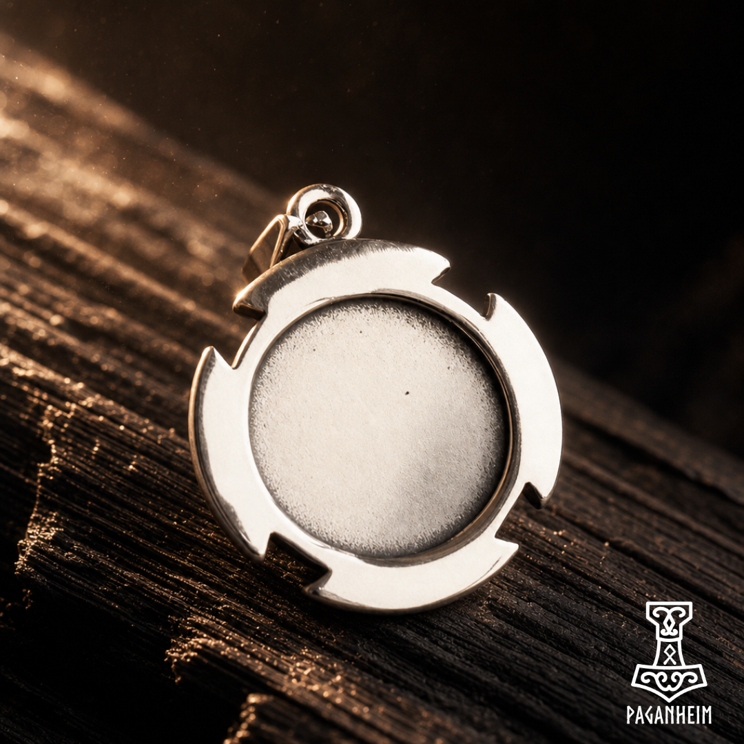 Closeup of Celtic cross amulet showing engraved knot patterns and polished finish