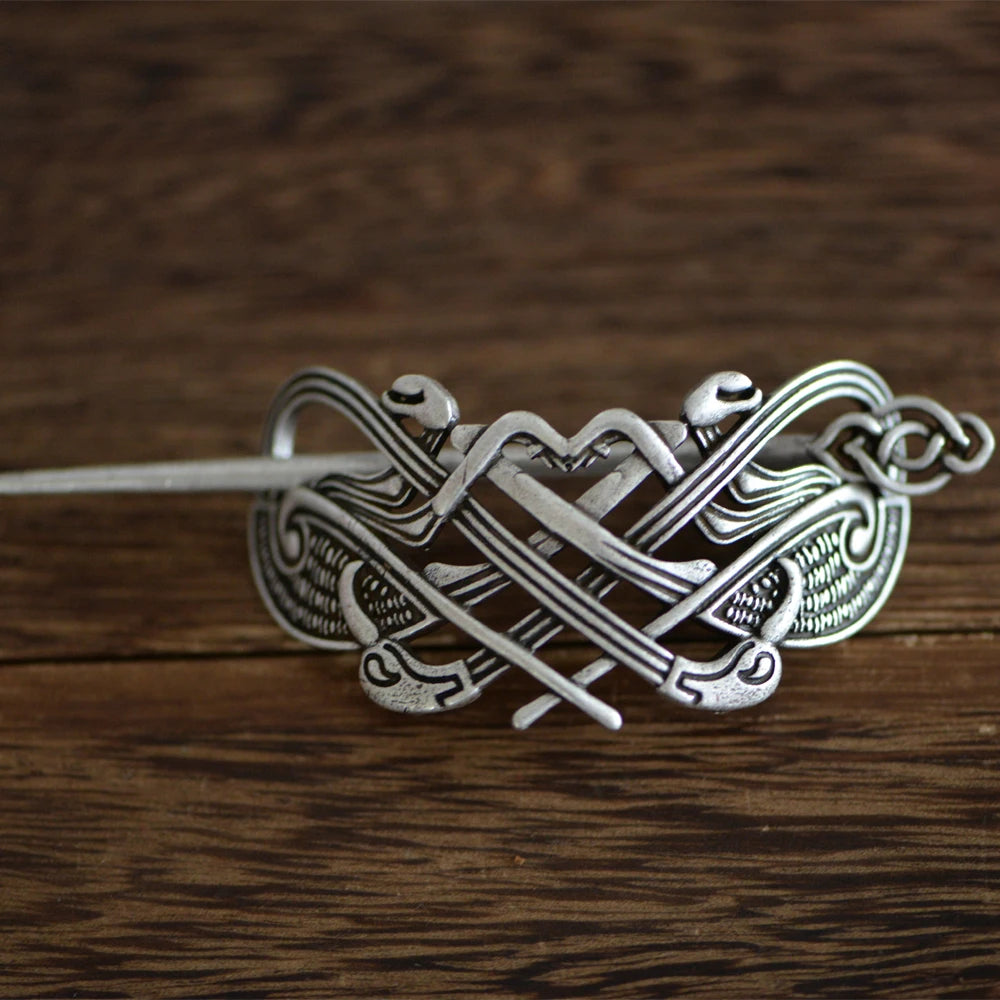 Hair pin designed in Viking Mammen and Ringerike styles with raven head elements.