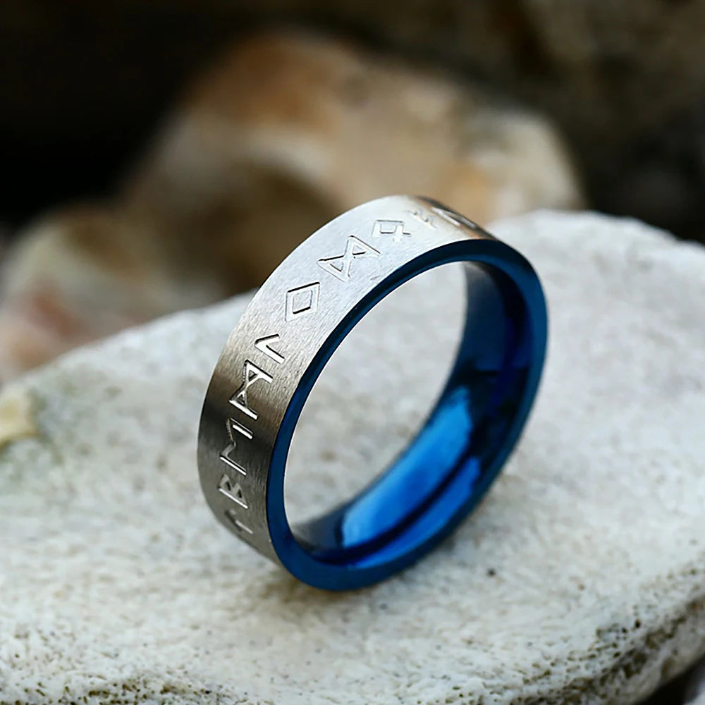 Close-up of Elder Futhark runes on a silver ring