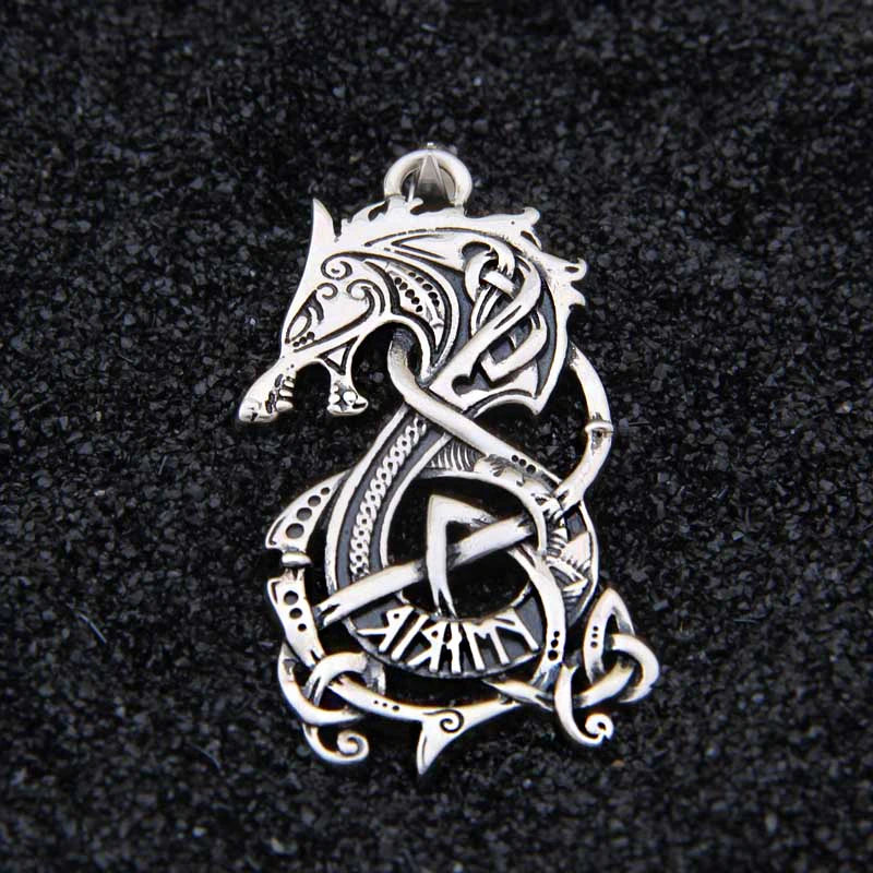 Ringerike-style Norse pendant with flowing interwoven patterns.