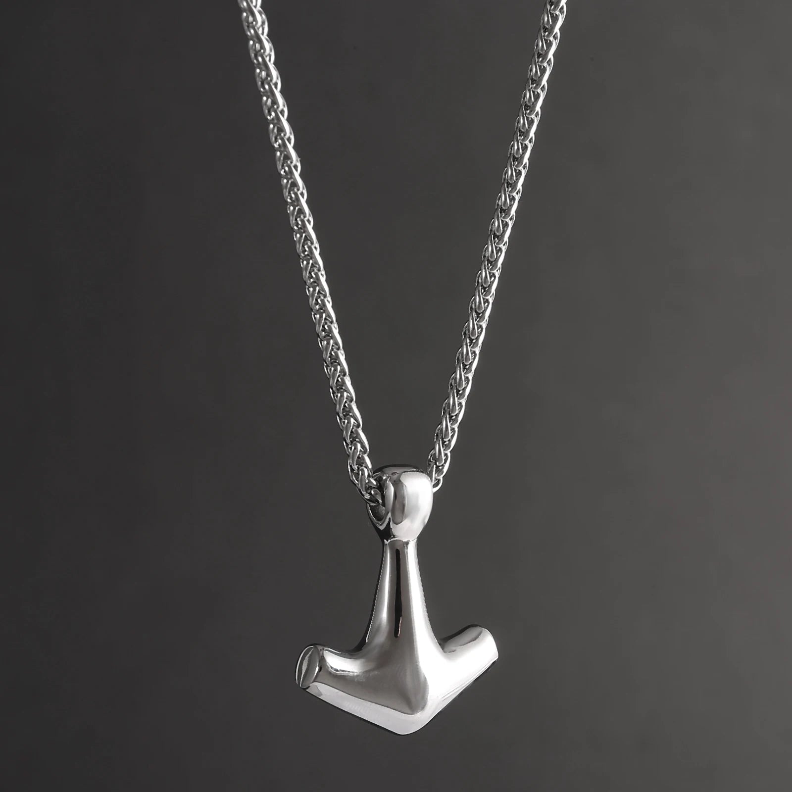 Minimalist Mjölnir pendant with a smooth design, crafted from stainless steel.