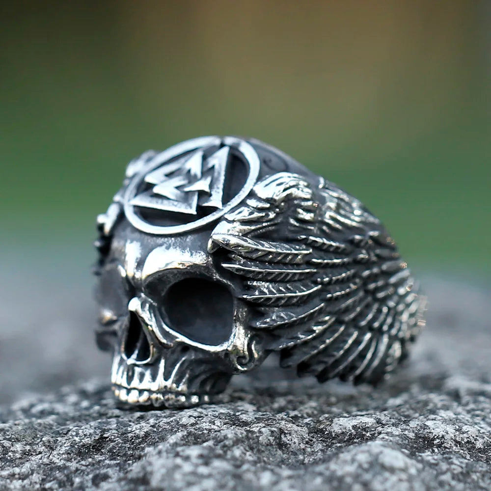 Viking skull ring featuring Valknut and raven wings, symbolizing death and the afterlife.