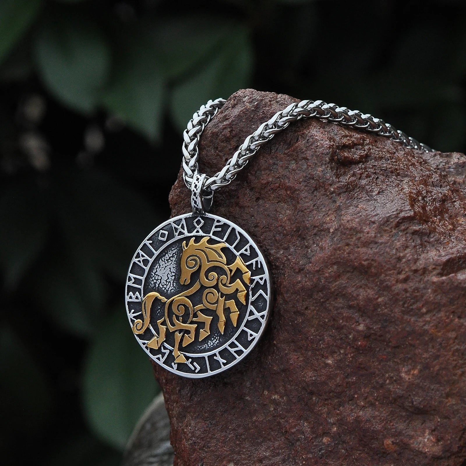 Sleipnir pendant necklace featuring a gold-engraved depiction of Odin's eight-legged horse on a silver base.