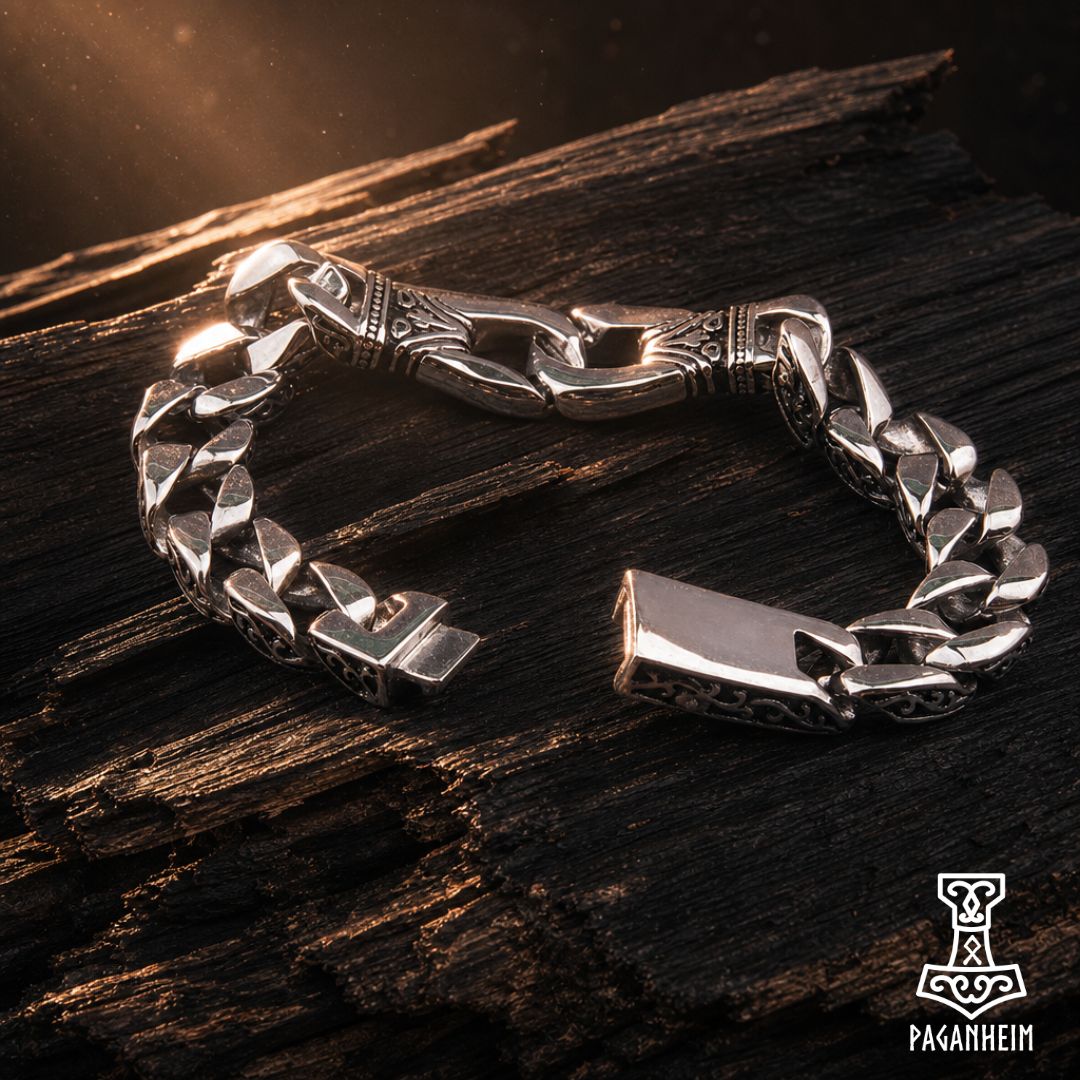 Closeup of Gleipnir bracelet showing detailed engravings and polished metal links.
