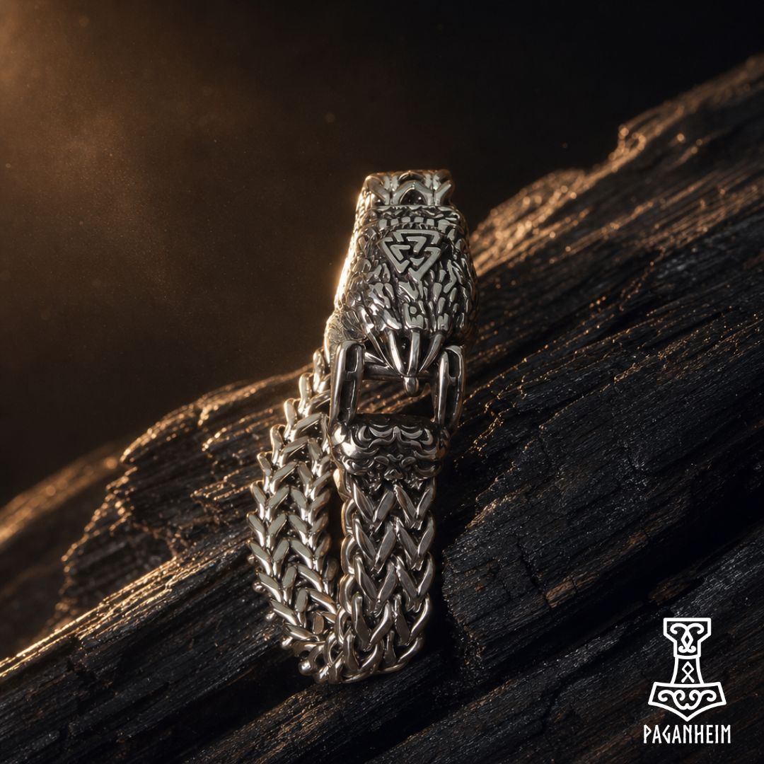 Norse bear‑claw bracelet resting on wooden surface under warm light