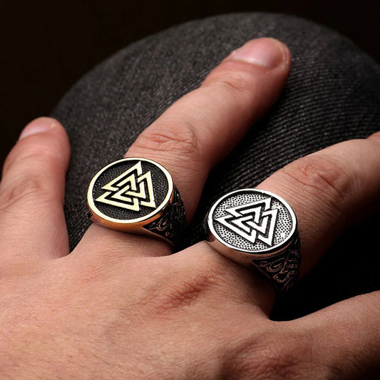 Stainless steel ring featuring the Valknut symbol on the crown, with intricate Nordic artistry on the sides representing the Web of Wyrd.