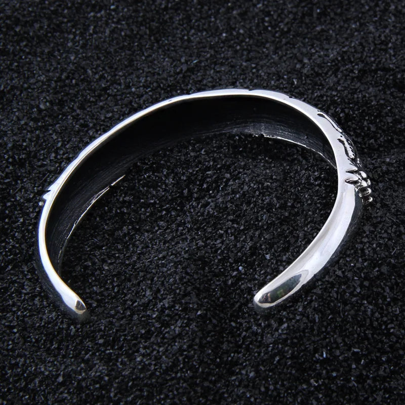 Viking-inspired sterling silver arm ring with traditional deep transverse grooves.