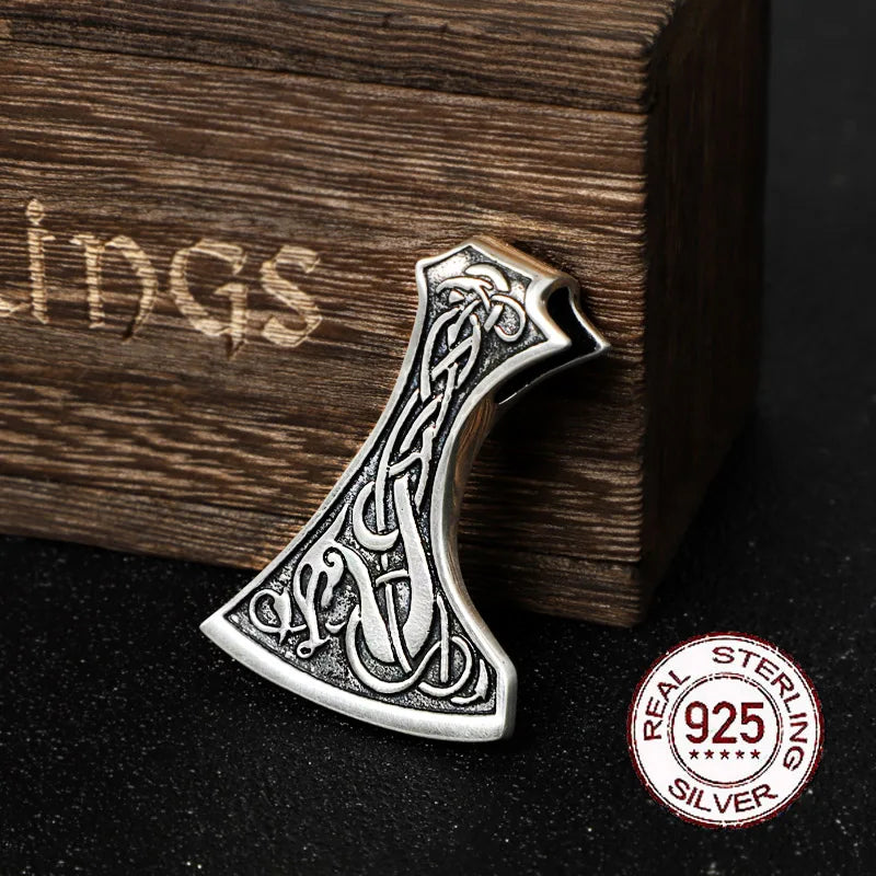 Sterling silver axe pendant engraved in Urnes art style.