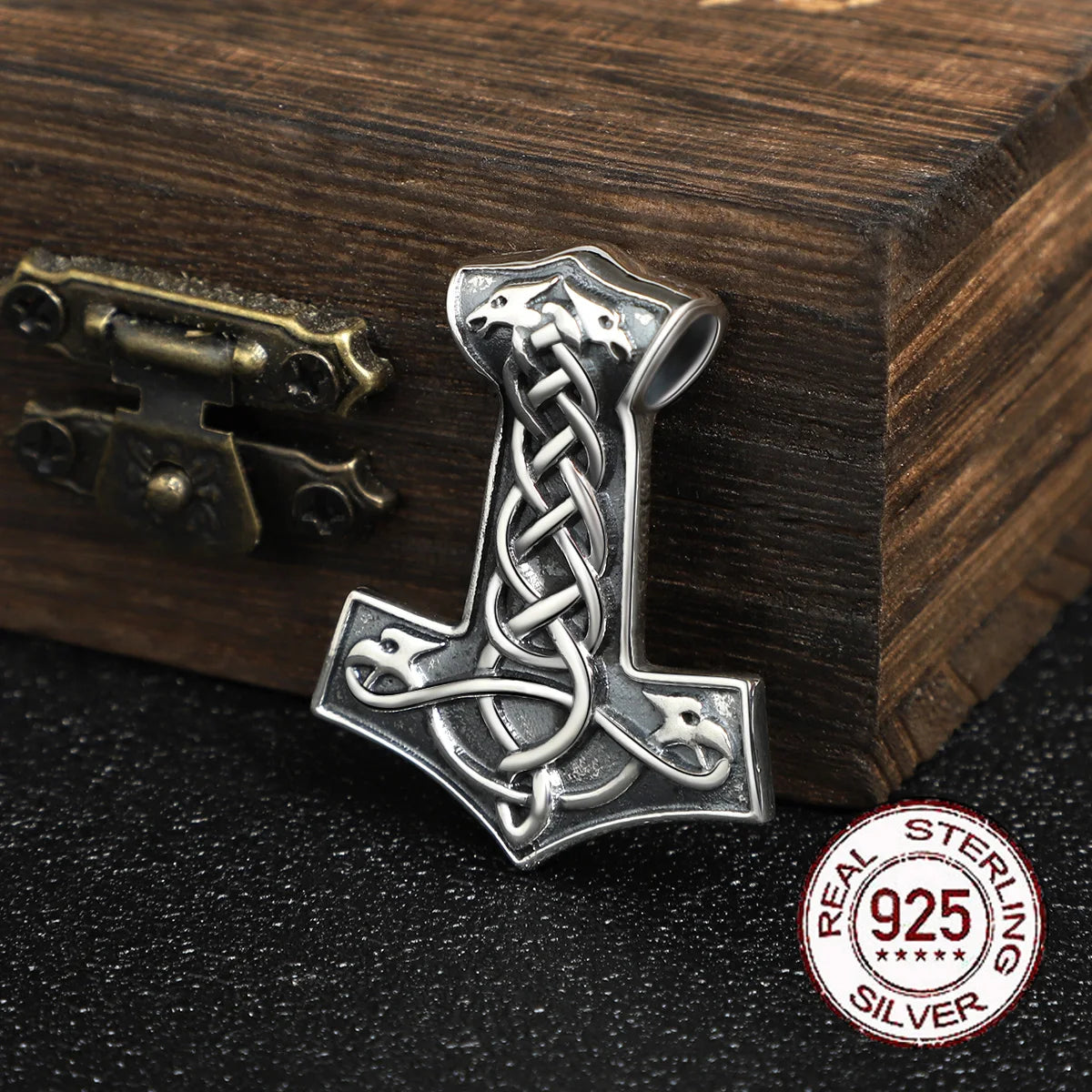 Sterling silver Mjölnir pendant with Jelling-style engravings and raven motifs.