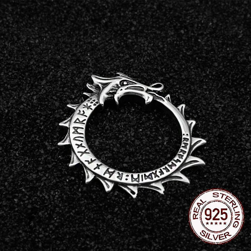 Sterling silver ouroboros amulet with Elder Futhark runes engraved.