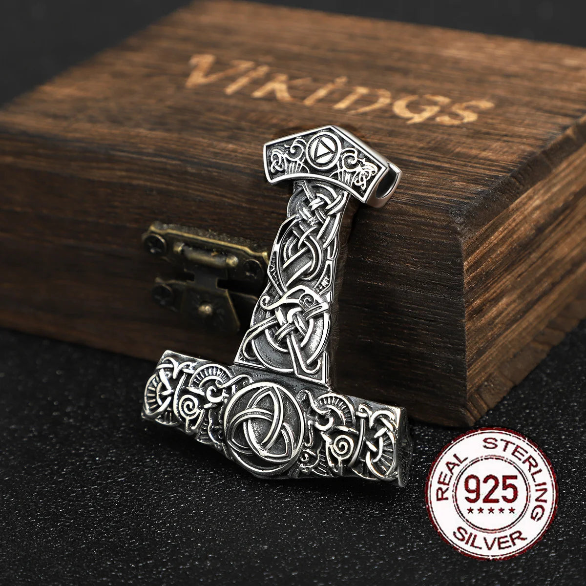 Sterling silver pendant featuring Thor’s Hammer with a Celtic triquetra design.