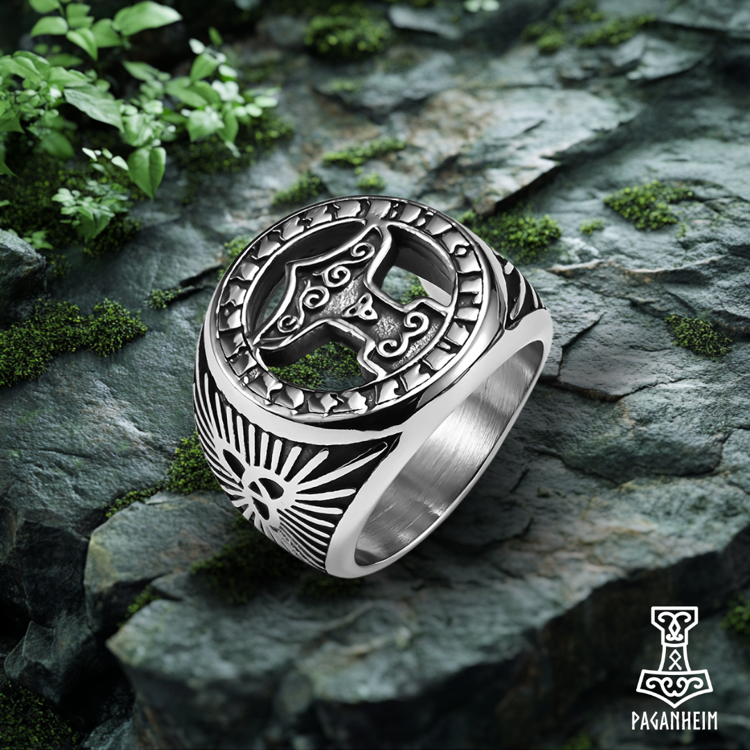 Detailed Mjölnir ring in silver, showcasing ancient Norse art.