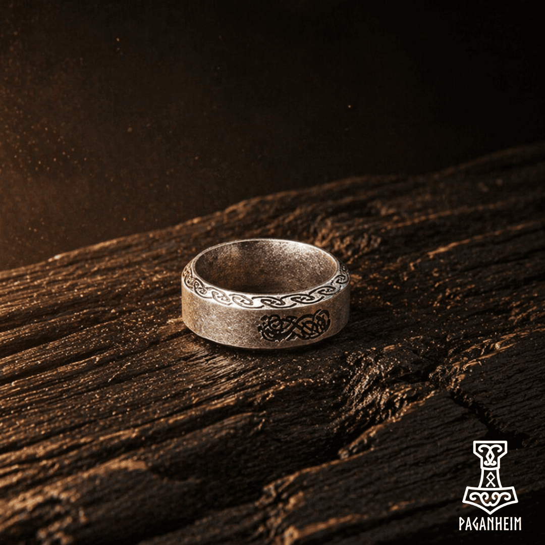 Urnes‑style ring with interlaced animal and ribbon patterns