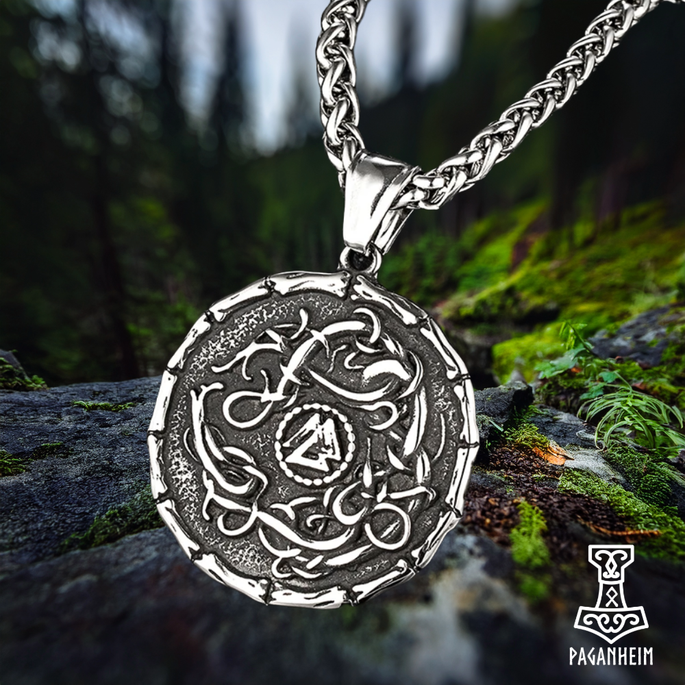 Odin’s Valknut symbol at the centre of an Urnes serpent pendant