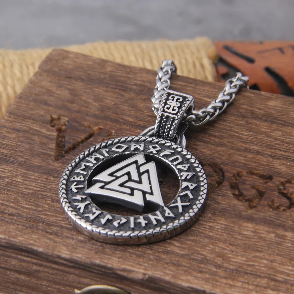 Close-up of the Valknut pendant with ancient runes framing the central symbol.