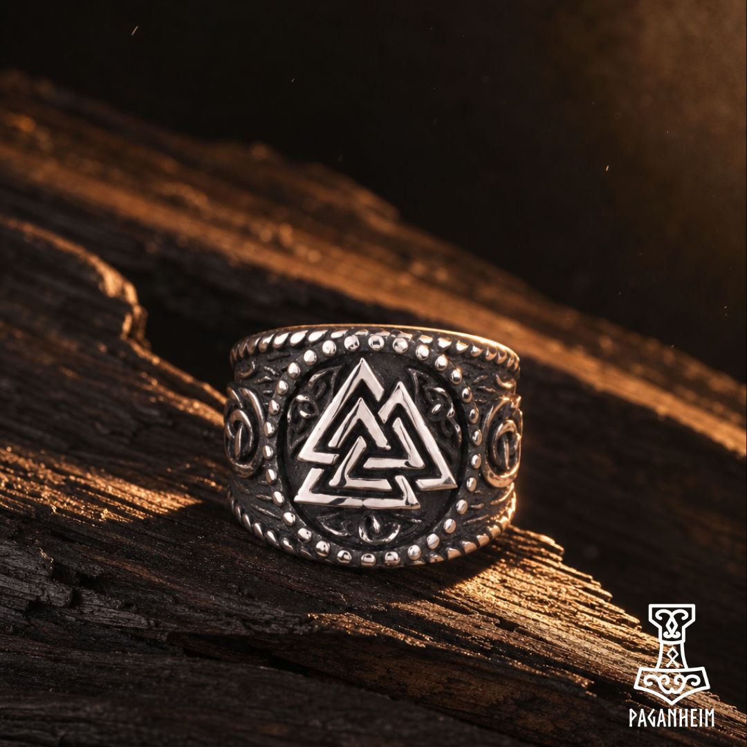 Close-up of Web of Wyrd design on darkened Valknut ring.