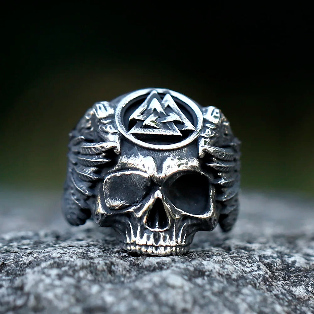 Norse mythology-inspired ring with skull, Valknut, and raven wings.