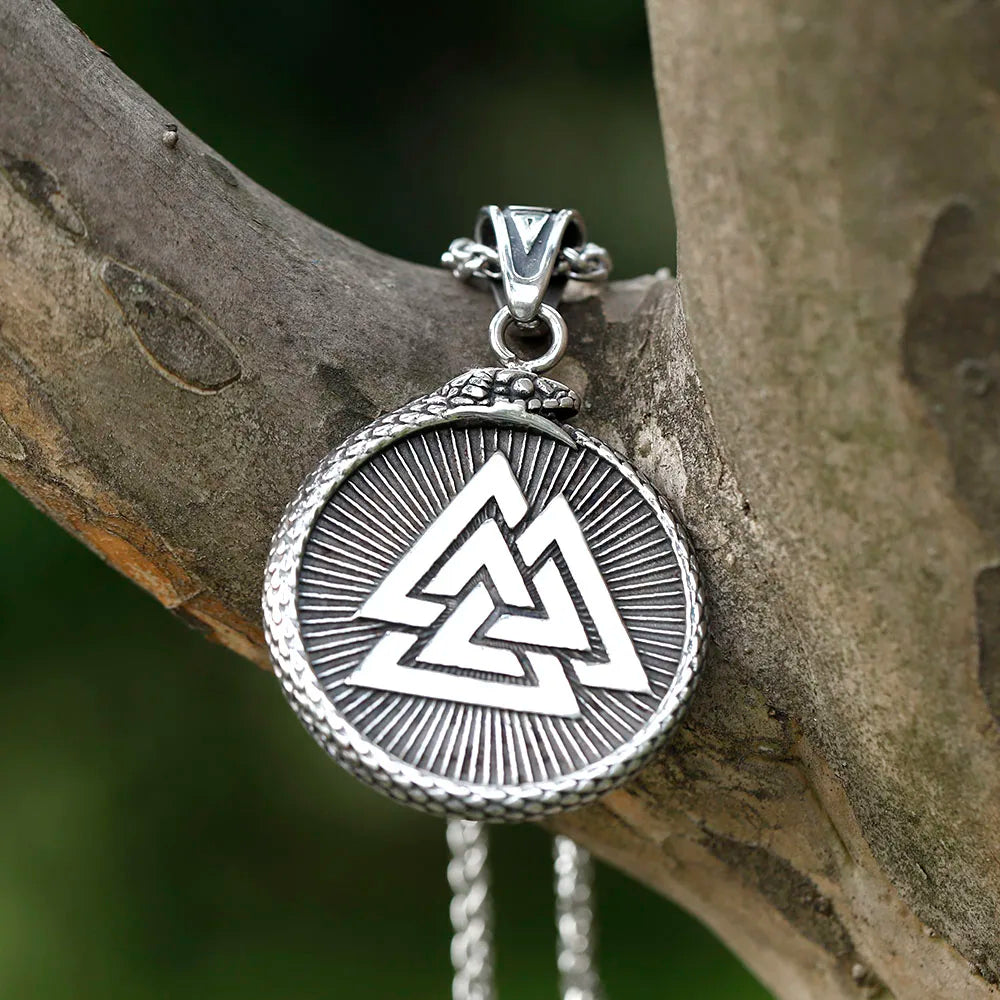 Vegvísir pendant featuring a coiling snake and the Valknut on the reverse.