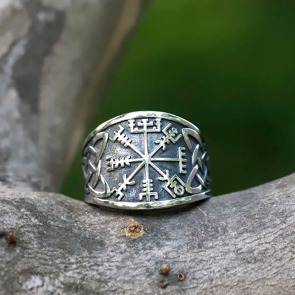 Norse-inspired ring with Vegvísir compass and engraved designs.