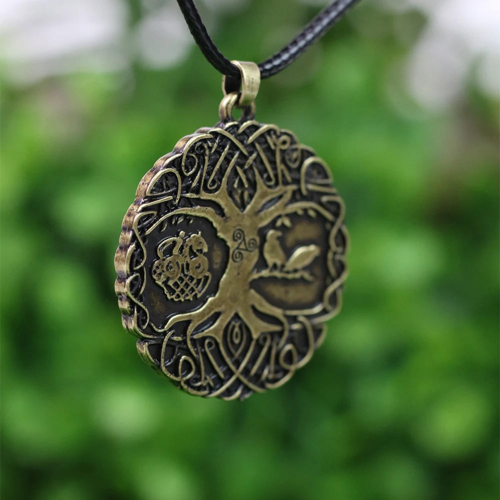 Yggdrasil pendant engraved with Odin on Sleipnir from the Tjängvide stone and the Triquetra symbol.