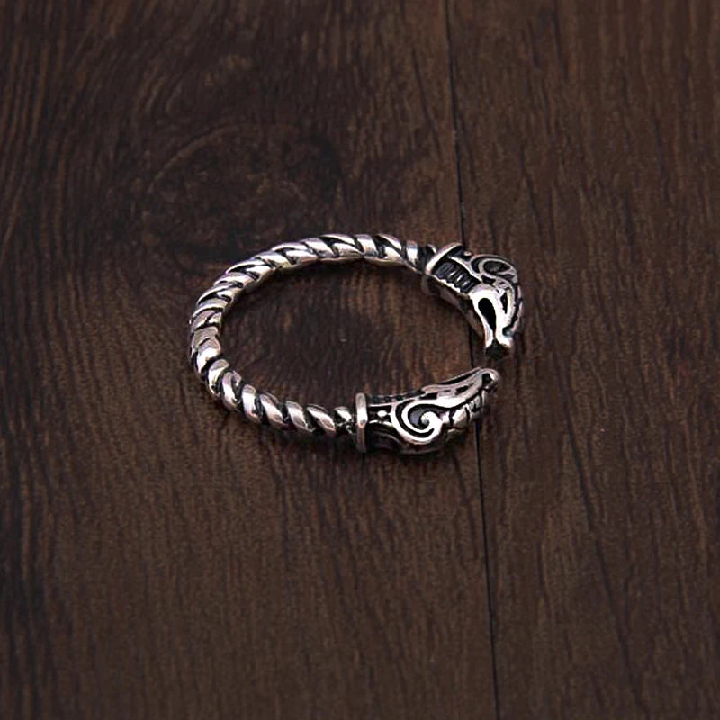 Twisted rod sterling silver ring with goat heads inspired by Old Norse jewelry.